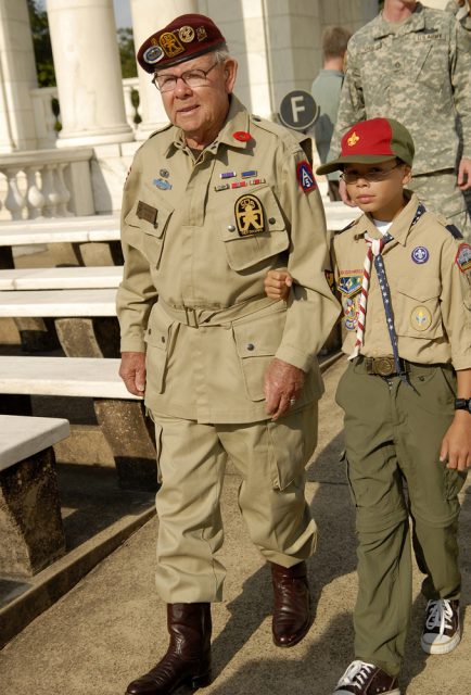 Several troops from the Boy Scouts of America helped escort the veterans from their bus into Arlington National Cemetery’s Memorial Amphitheater for the Operation Dragoon commemoration ceremony August 5, 2009. Troops from across the country, as well as Soldiers from the Fort Myer Military Community, helped the veterans around the cemetery.