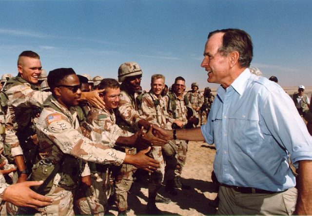 President George Bush attending U.S. troops in Saudi Arabia on Thanksgiving Day, November 22, 1990.