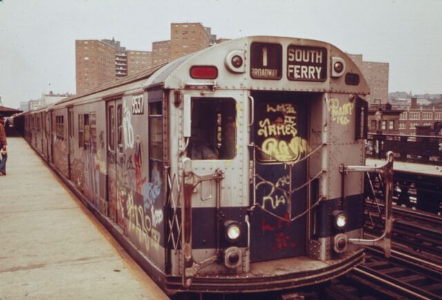 A subway car marked with extensive graffiti