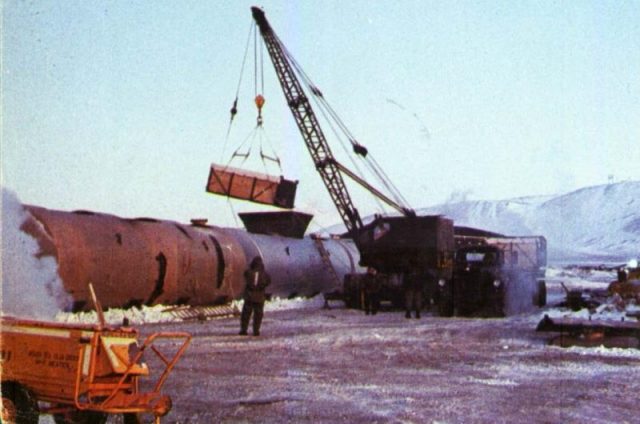 Contaminated ice being loaded into steel tanks at Thule during Project Crested Ice.