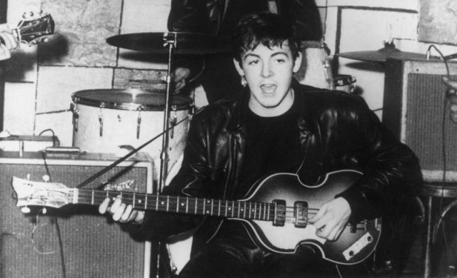 Paul McCartney on stage at the Cavern nightclub in Liverpool during the early days of British beat group The Beatles. Photo by Keystone/Getty Images