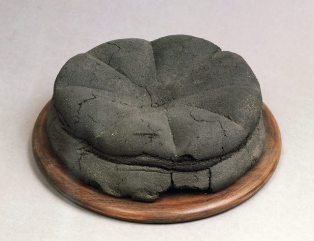 Charred loaf, from Modestus’ bakery, Pompeii, Campania, Italy. Roman civilization, 1st century. Naples, Museo Archeologico Nazionale (Archaeological Museum) (Photo by DeAgostini/Getty Images)