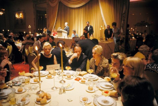 The Velvet Underground’s guest table at the New York Society for Clinical Psychiatry annual dinner, The Delmonico Hotel, New York, January 13, 1966. L-R Barbara Rubin, Candy Darling, Jonas Mekas, Edie Sedgwick, Gerard Malanga and Nico. Photo by Adam Ritchie/Redferns