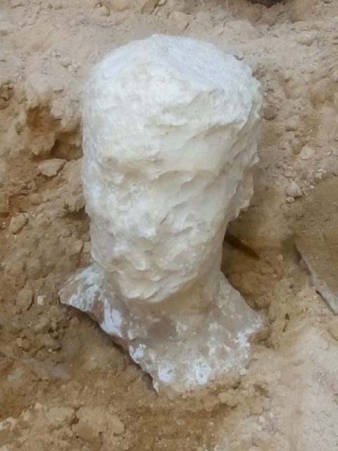 This picture released on July 1, 2018, by the Egyptian Ministry of Antiquities shows the alabaster head of a man found in an ancient tomb dating back to the Ptolemaic period, dug out in the Sidi Gaber district of Alexandria. Photo credit /AFP/Getty Images