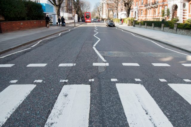 Abbey Road zebra crossing made famous by the 1969 Beatles album, in London, England.