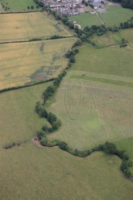 Photograph of Monks Ditch showing cropmarks of strip field systems. Photo by Royal Commission on the Ancient and Historical Monuments of Wales (RCAHMW)