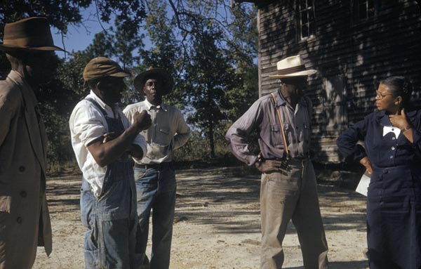 Tuskegee Syphilis Study participants talking with Nurse Eunice Rivers, a coordinator of the study, c. 1970.