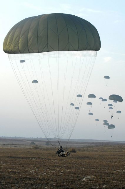 U.S. Army paratroopers with the 82nd Airborne Division parachute from a C-130 Hercules aircraft during Operation Toy Drop, 2007, at Pope Air Force Base.