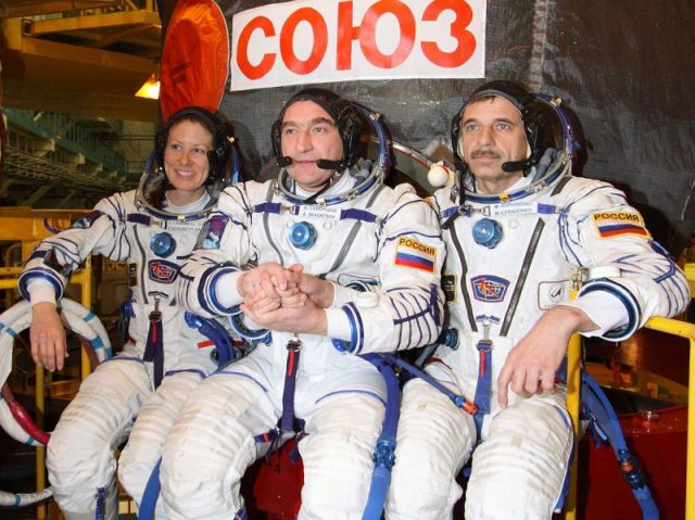 Soyuz TMA-18 Crew in front of the capsule.