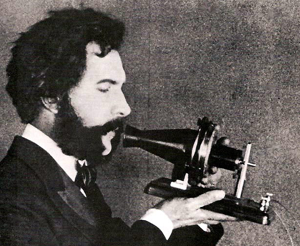 An actor portraying Alexander Graham Bell in a 1926 silent film shows Bell’s first telephone transmitter (microphone), invented 1876 and first displayed at the Centennial Exposition, Philadelphia.