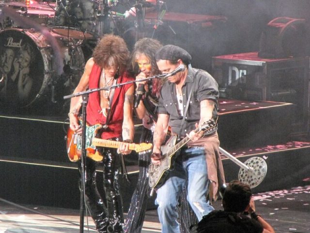 Aerosmith performing with Johnny Depp in July 2014 in Mansfield, MA. Photo by bobnjeff CC BY 2.0