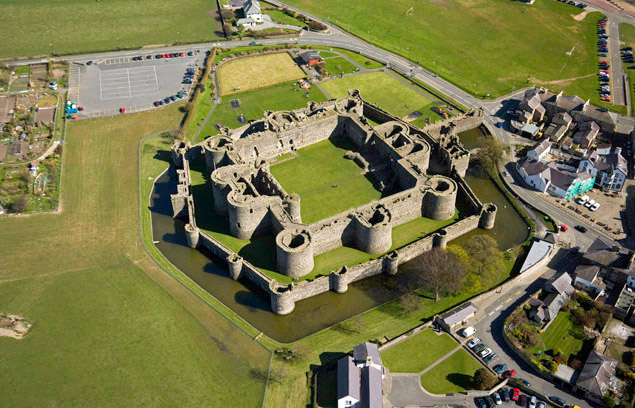 Beaumaris Castle, on the island of Anglesey at the north-west of Wales, was built in 1295. Notice the space in between the smaller exterior wall and the major fortification.