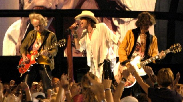 Brad Whitford, Steven Tyler, and Joe Perry of Aerosmith performing at the NFL Kickoff in Washington, DC on September 4, 2003.