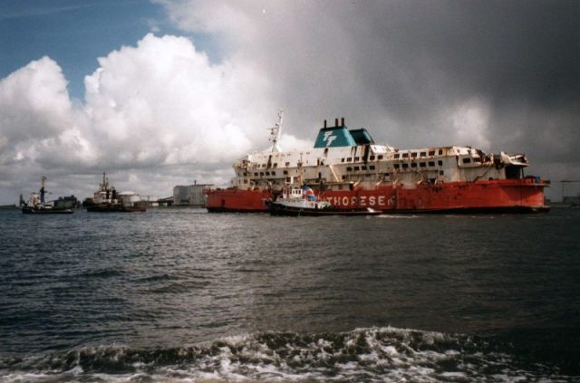 Zeebrugge ferry disaster: MS Herald of Free Enterprise towed into the harbour at Vlissingen after salvage, May 1987. Photo by Archief Ranter CC BY-SA 1.0