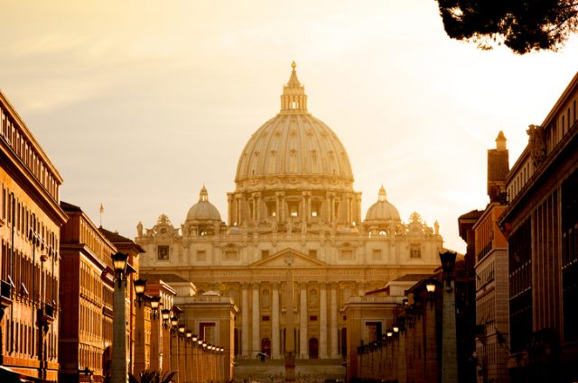 Vatican City – August 21, 2008: St. Peter’s Basilica at sunset from Via della Conciliazione. Vatican City State, Rome, Italy.