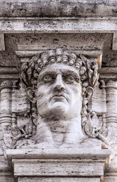 A statue relief of emperor Nero’s head on the gateway entrance to the park that contains the ruins of his golden palace at Domus Aurea in Rome.