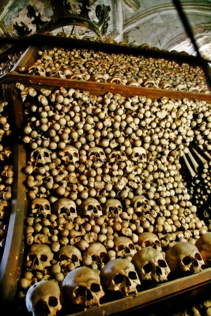 Bohemia, Kutna Hora, Czech Republic – May 23, 2011 – Decorative human bones and skulls in Bone church or Sedlec Ossuary (Kostnice v Sedlci), a small Roman Catholic chapel.