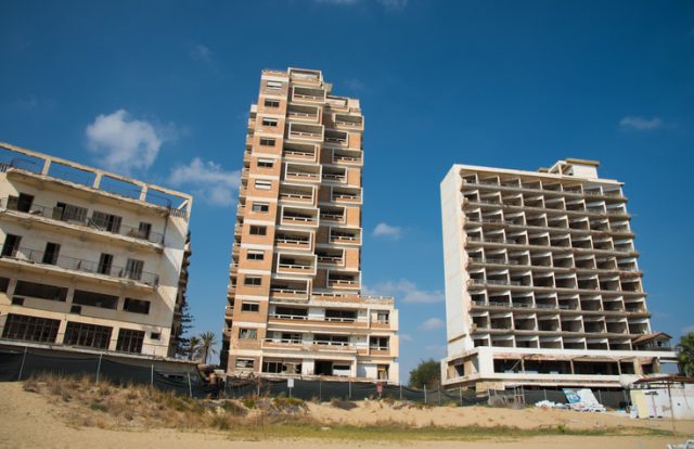 Famagusta, Cyprus – September 15, 2016: Palm Beach and with abandoned hotels at Varosha ghost town, Famagusta, Northern Cyprus.