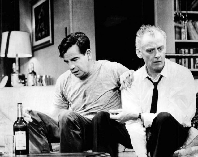 Photo of Walter Matthau as Oscar Madison and Art Carney as Felix Ungar from the original Broadway production of The Odd Couple. 1965