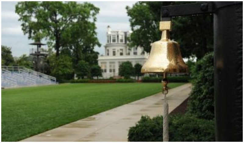 A ceremonial bell hangs at the front of the center walk at Marine Barracks Washington (MBW) in Washington before an evening parade.