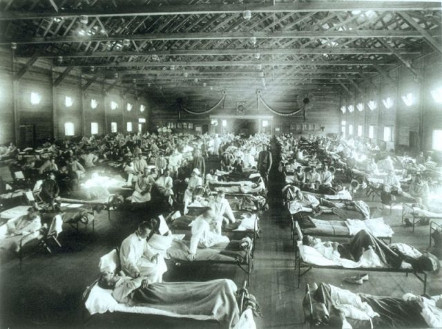 Soldiers from Fort Riley, Kansas, ill with Spanish influenza at a hospital ward at Camp Funston.