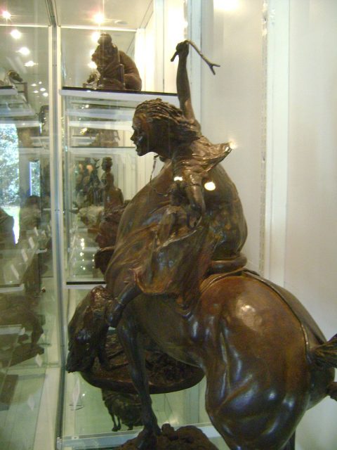 A side view of a statue of Sybil Ludington.