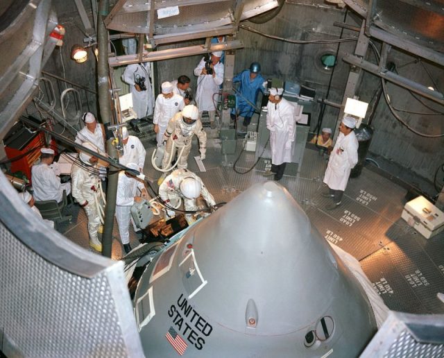 The Apollo 1 crewmen enter their spacecraft in the altitude chamber at Kennedy Space Center, October 18, 1966.