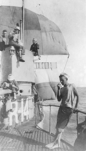 Seen here are the jury-rigged sails used to bring R-14 back to port in 1921; the mainsail rigged from the radio mast is the top sail in the photograph, and the mizzen made of eight blankets also is visible. R-14’s acting commanding officer, Lieutenant Alexander Dean Douglas, USN, is at top left, without a hat.