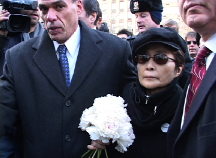 Yoko Ono delivering flowers to Lennon’s memorial Strawberry Fields in Central Park on the 25th anniversary of his death, December 8, 2005. Photo by Hamletphase CC BY 2.0