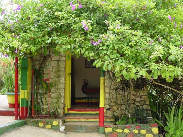 Bob Marley house in Nine Mile, Jamaica. Bob Marley lived in this house when he was young and also returned here many times in his life, but he was born in his mother’s house which can be seen from the bar outside the gates. Photo by david_e_waldron CC BY 2.0