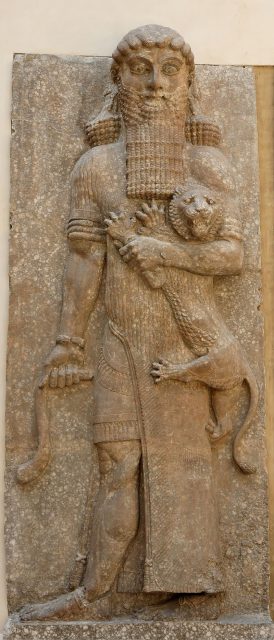 Possible representation of Gilgamesh as Master of Animals, grasping a lion in his left arm and snake in his right hand, in an Assyrian palace relief, from Dur-Sharrukin, now held in the Louvre.