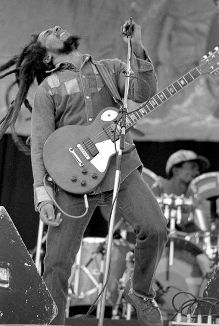 Black and white image of Bob Marley on stage. Photo by Eddie Mallin CC BY 2.0