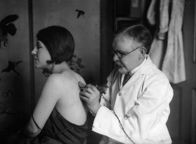 A woman having her back tattooed, circa 1930. (Photo by General Photographic Agency/Getty Images)