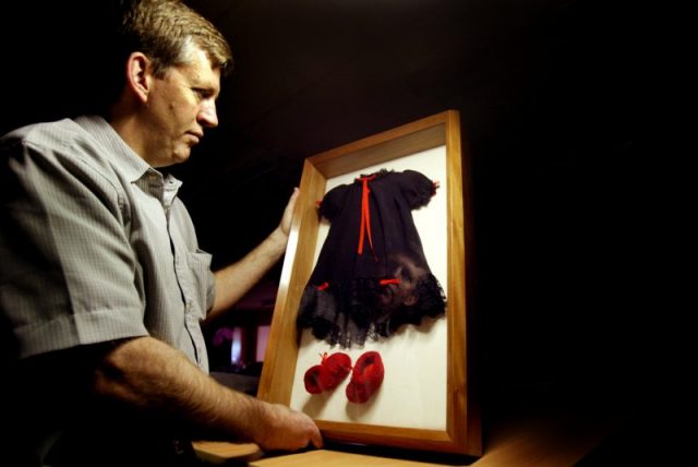 Azaria Chamberlain’s black clothes, which provoked lots of conspiracy therories, are going on display at the National Museum of Australia in a new exhibition. The image shows curator Guy Hansen in Canberra, 6 September 2005. SMH Picture by CHRIS LANE (Photo by Fairfax Media/Fairfax Media via Getty Images)