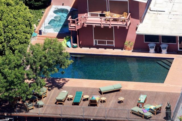 Jack Nicholson Mulholland Drive Estate – a modest 4 BR 3 BA 3303 square foot home. He is known to jump from the second floor balcony directly into the pool, and loves to smack golf balls into the canyon below. Photo by Philip Ramey/Corbis via Getty Images