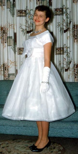 Girl in prom dress, USA, 1950s.