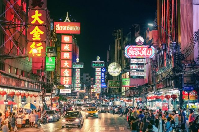 Chinatown, Bangkok, Thailand – 9 JANUARY, 2016: Cars and shops on Yaowarat road, the main street of Chinatown.