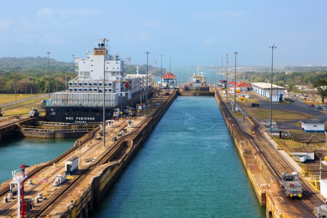 Panama canal-March 11,2016: three-Chamber gateway “Gatun”. From the Atlantic ocean, the first on the canal route is a three-chamber gateway “Gatun”, which connects the Lemon Bay with lake Gatun. Here locks lift vessels on 26 m to the level of the lake of the same name. Wiring of large ships through the locks is provided by a special small train locomotives on electric traction.