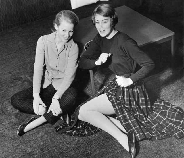 Two girls in their dance shoes – perhaps taking a break from practicing their Lindy hop moves. Photo by Erik Holmén, Nordiska museet CC BY 4.0