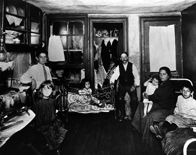 Poor family in one room tenement apartment, New York, circa 1880s