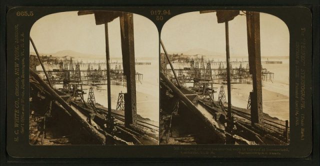 Pumping oil from the sea – oil wells in the surf of Summerland, California. Photo by H.C. White Co