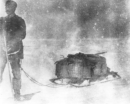 Strindberg on snowshoes with heavily laden, impractical sled.