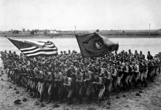 United States Marines pose in a wedge formation in 1918.