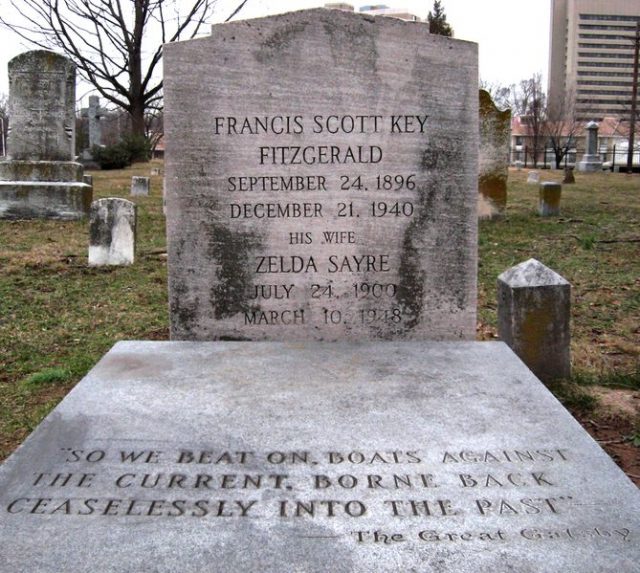 The grave of F. Scott Fitzgerald and Zelda Fitzgerald in St. Mary’s Catholic Cemetery in Rockville, Maryland. The quote is the final line of The Great Gatsby.