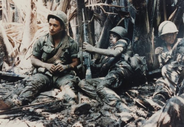 U.S. army troops taking a break while on patrol during the Vietnam War.