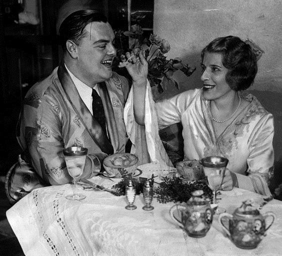 Aimee Semple McPherson and her third husband, David L. Hutton, enjoying their honeymoon breakfast.