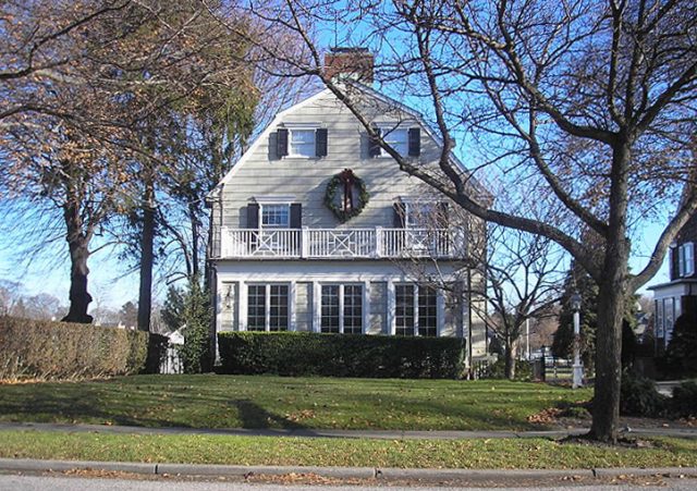 The house featured by the movie The Amityville Horror, built c. 1924, at 112 Ocean Avenue, Amityville, New York, United States. By the time this photograph was taken, the address had been changed to discourage curiosity-seekers.