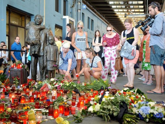 Commemorative event in July 2015 at the Prague Main Railway Station sculpture. Photo by David Sedlecký CC BY-SA 4.0