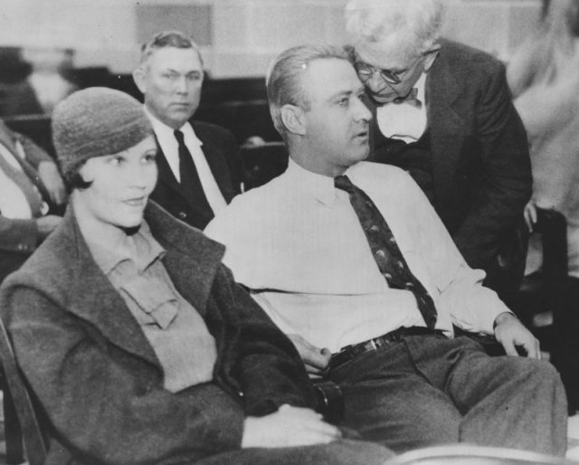 American gangster George Kelly Barnes (1895 – 1954), aka Machine Gun Kelly, at his trial for the kidnapping of businessman Charles F. Urschel, at the Federal Court in Oklahoma City, October 1933. On the left is Kelly’s wife and co-defendant, Kathryn Kelly. Photo by FPG/Archive Photos/Getty Images