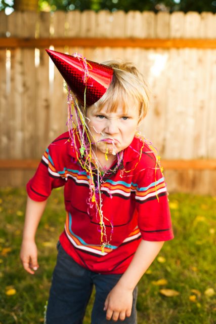 Grumpy party kid.